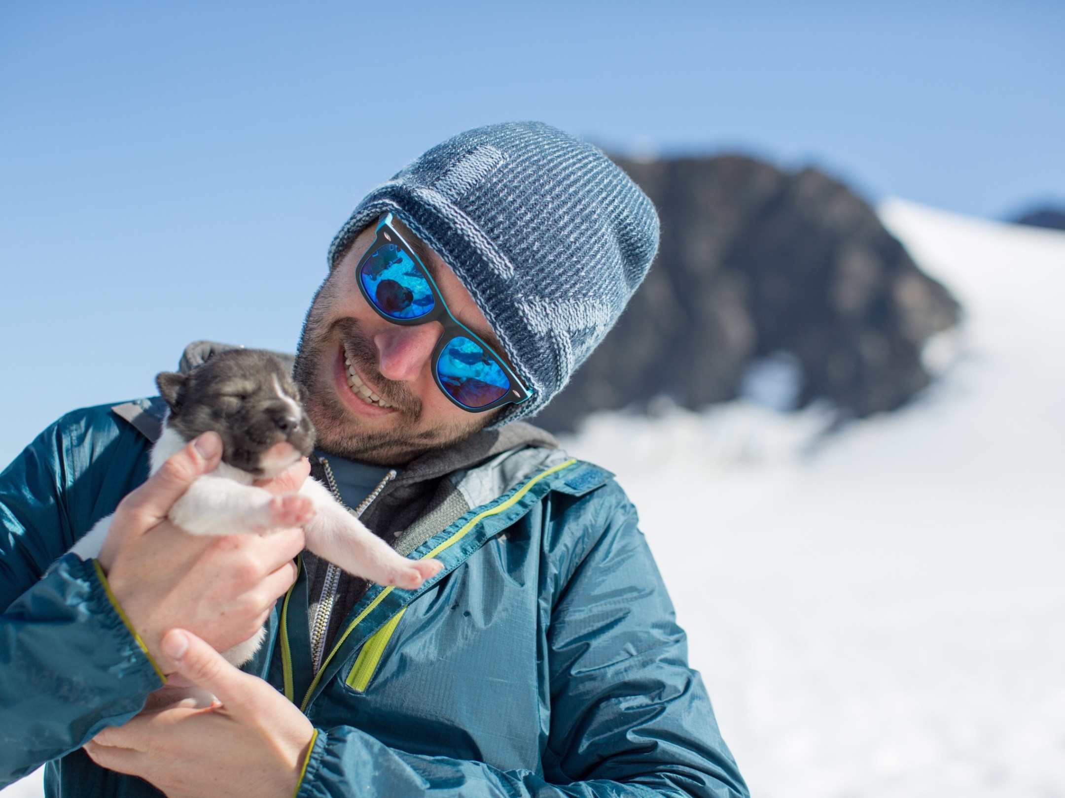a person wearing a hat with snow on the ground