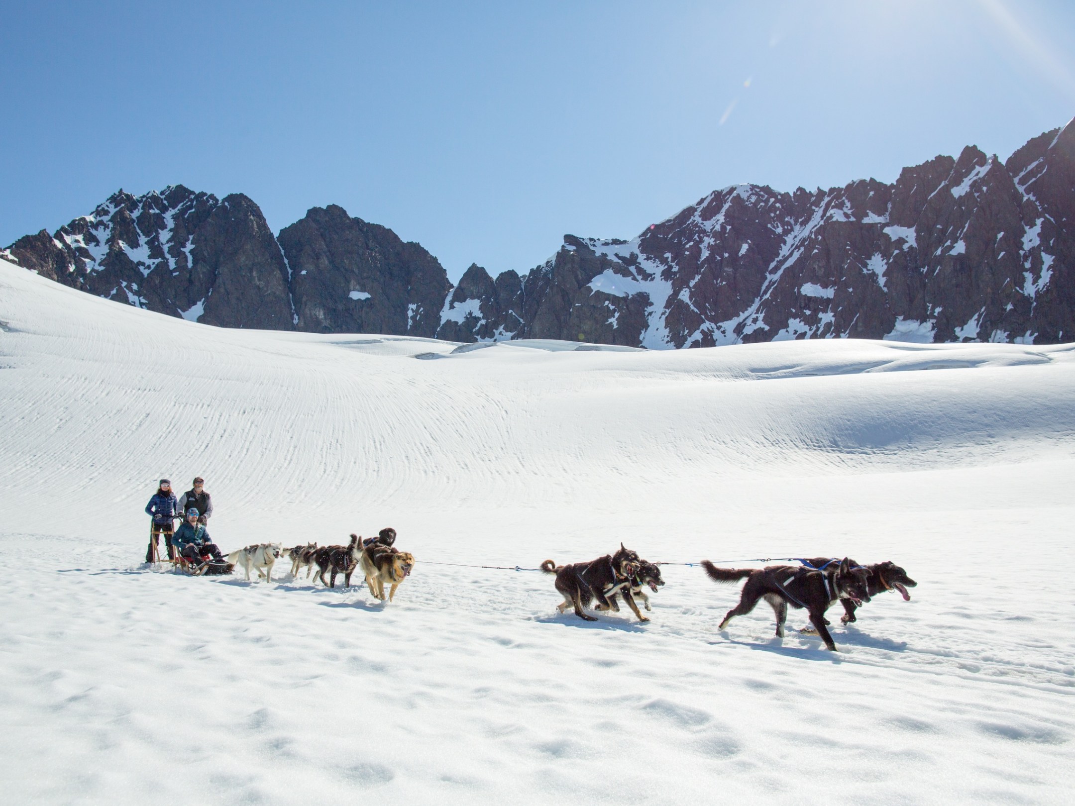 a group of people walking in the snow